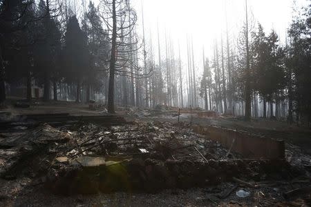 The remains of a structure burned by the King Fire is seen in White Meadows, northeast of Sacramento, California September 20, 2014. REUTERS/Stephen Lam