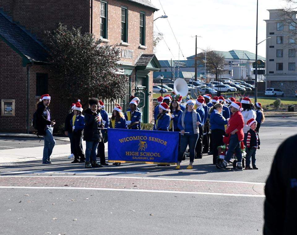 Marching bands get ready for a Christmas Parade Sunday, Dec. 5, 2021, in Salisbury, Maryland.