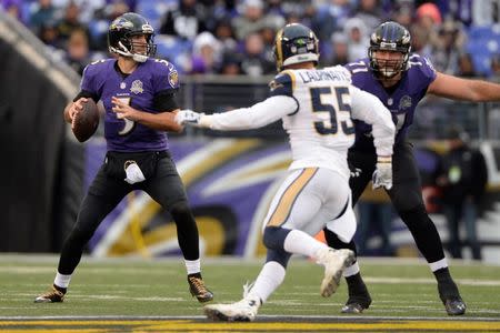 Nov 22, 2015; Baltimore, MD, USA; Baltimore Ravens quarterback Joe Flacco (5) passes during the fourth quarter against the St. Louis Rams at M&T Bank Stadium. Baltimore Ravens defeated St. Louis Rams 16-13. Mandatory Credit: Tommy Gilligan-USA TODAY Sports