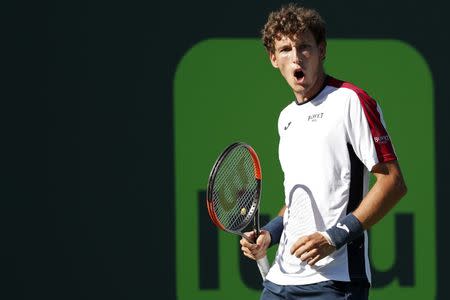 Mar 29, 2018; Key Biscayne, FL, USA; Pablo Carreno Busta of Spain reacts after winning a point against Kevin Anderson of South Africa (not pictured) on day ten of the Miami Open at Tennis Center at Crandon Park. Mandatory Credit: Geoff Burke-USA TODAY Sports