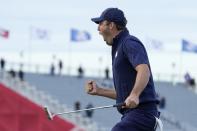Team USA's Scottie Scheffler reacts to making his putt and winning the 15th hole during a four-ball match the Ryder Cup at the Whistling Straits Golf Course Saturday, Sept. 25, 2021, in Sheboygan, Wis. (AP Photo/Ashley Landis)