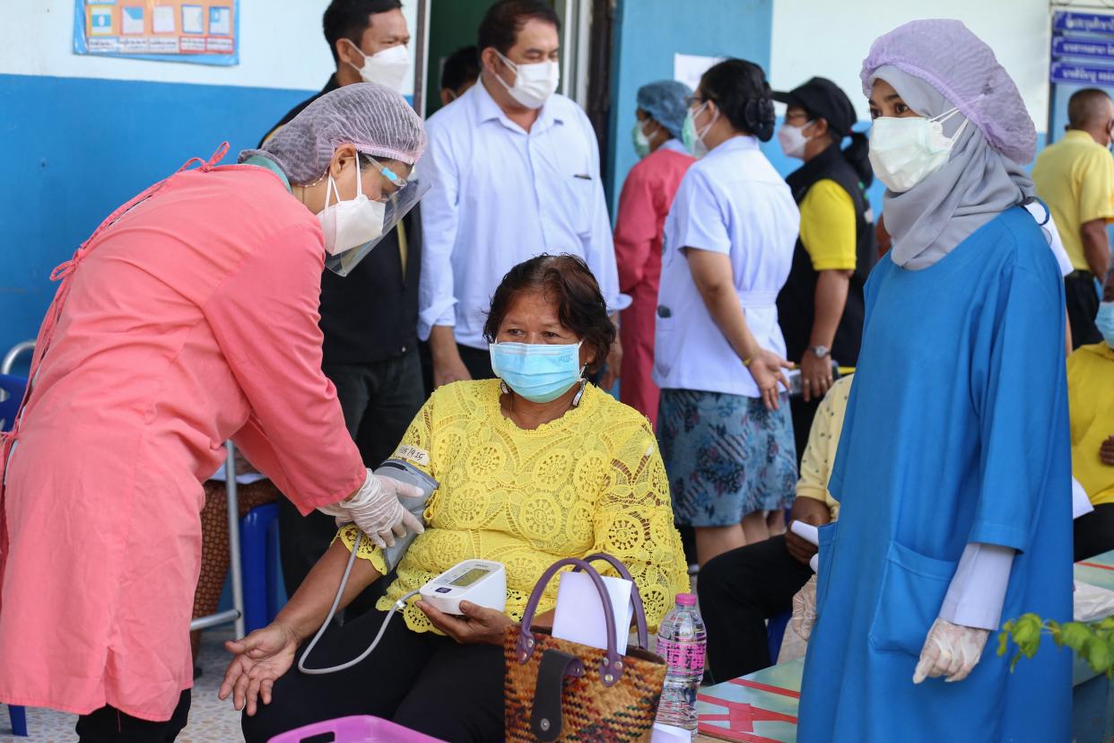 A woman gets her blood pressure checked as officials at Khok Pho Hospital prepare to administer the AstraZeneca vaccine for Covid-19 to some 200 people (Getty Images)