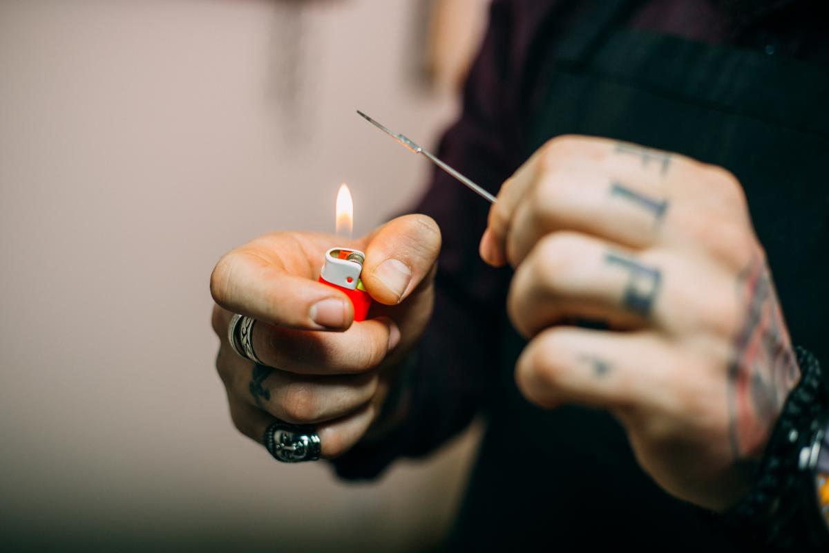 Why You Shouldn't Give Yourself a Stick and Poke Tattoo Right Now