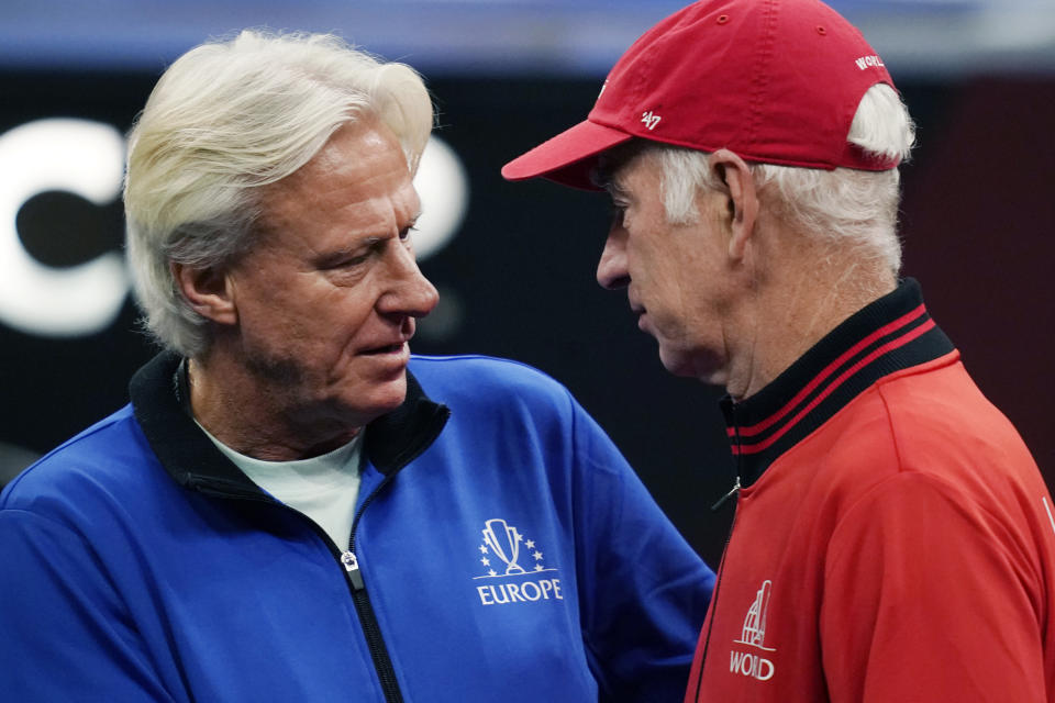 Team Europe's captain Bjorn Borg, left, chats with Team World's captain John McEnroe prior to Laver Cup tennis competition, Sunday, Sept. 26, 2021, in Boston. (AP Photo/Elise Amendola)