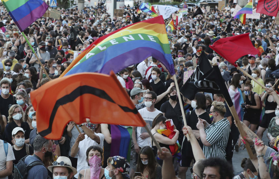 File - In this Saturday, Aug. 8, 2020 file photo LGBT rights supporters protest against rising homophobia in Warsaw, Poland. Ambassadors to Poland from some 50 countries and international organizations have expressed their support with an open letter published Sunday, for the LGBT community in the country. (AP Photo/Czarek Sokolowski)