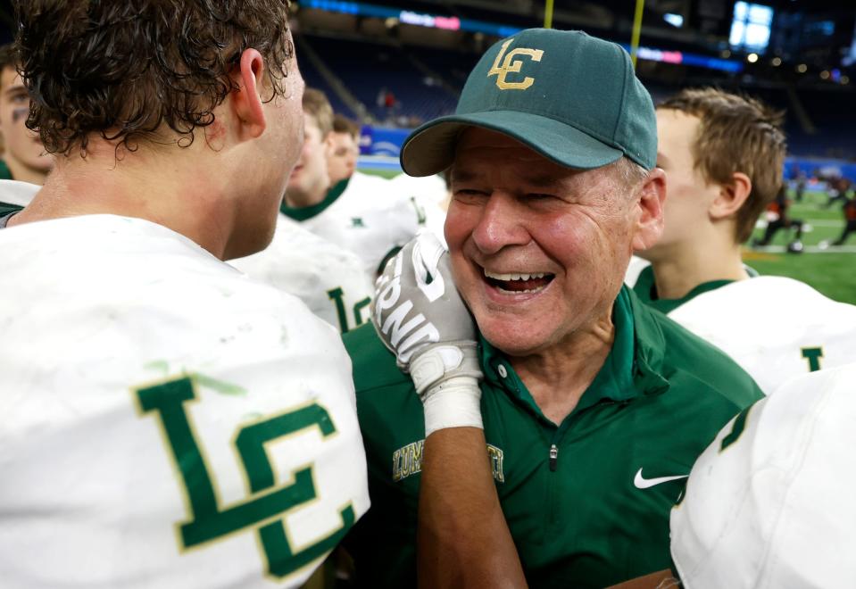 Jackson Lumen Christi head coach Herb Brogan is all smiles celebrating the 15-12 win over Traverse City St. Francis in the MHSAA Division 7 football final at Ford Field in Detroit on Saturday, Nov. 26, 2022.