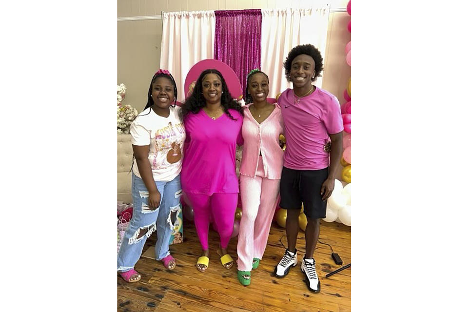 This undated photo provided by the family of Phil Dowdell shows from left, Zaniriah Dowdell, Latonya Allen, Alexis Dowdell and Phil Dowdell. Phil Dowdell was one of four young people killed when a shooting broke out at a Sweet 16 birthday party in Dadeville, Ala., on April 15, 2023. Dowdell was headed to Jacksonville State University in the fall where he planned to play football. (Family of Phil Dowdell via AP)