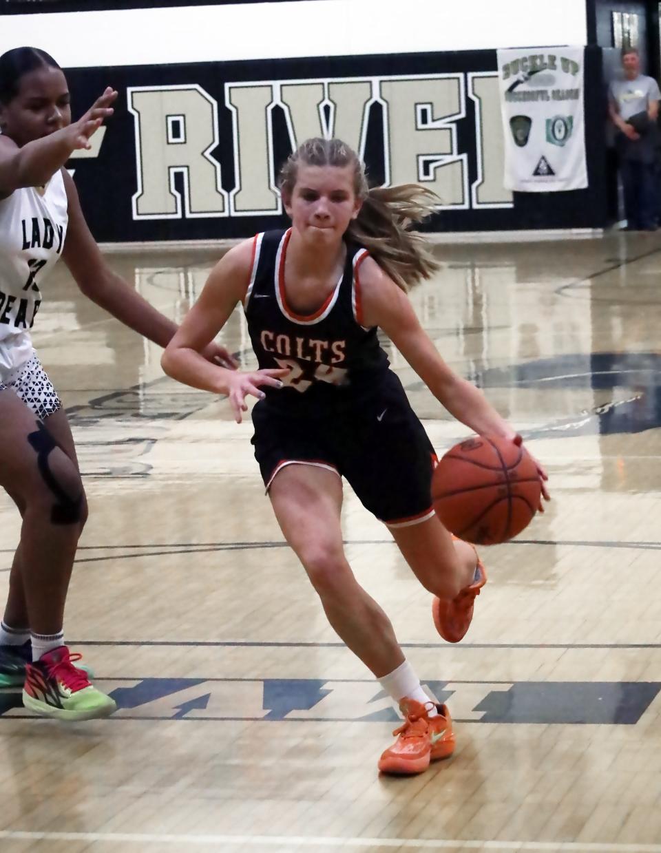 Meadowbrook's Marabelle Thornberry (24) drives the lane during the girls' basketball game Wednesday at River View High School.