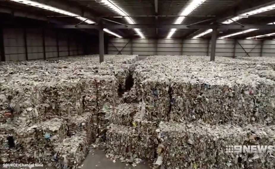 Tonnes of recyclables are seen in a warehouse in Derrimut, Victoria. 