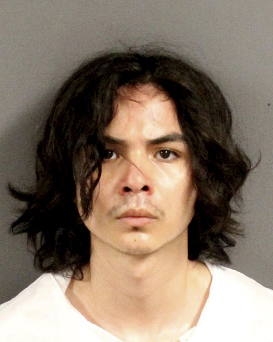 This photo provided by the Yolo County Sheriff's Department shows Carlos Dominguez, of Davis, who was arrested for the three stabbings. Police say Dominguez a 21-year-old who was a student at the University of California, Davis, until last week was arrested for allegedly committing three recent stabbings, including two that were fatal. (Yolo County Sheriff's Department via AP)