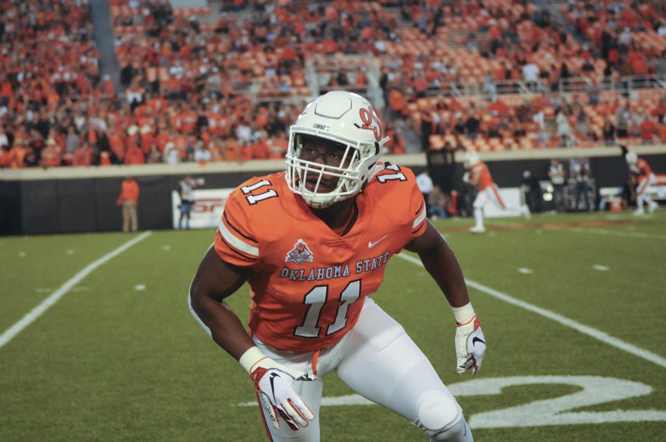 Oklahoma State linebacker Amen Ogbongbemiga warms up prior to an NCAA college football game in Stillwater, Okla., Saturday, Oct. 27, 2018. (AP Photo/Brody Schmidt)