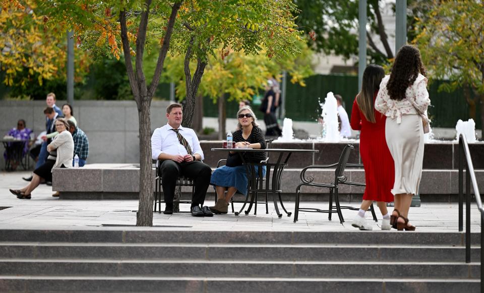 Scott and Amity Frewing sit outside and listen during Saturday afternoon session of the 193rd Semiannual General Conference of The Church of Jesus Christ of Latter-day Saints at the Conference Center in Salt Lake City on Saturday, Sept. 30, 2023. | Scott G Winterton, Deseret News