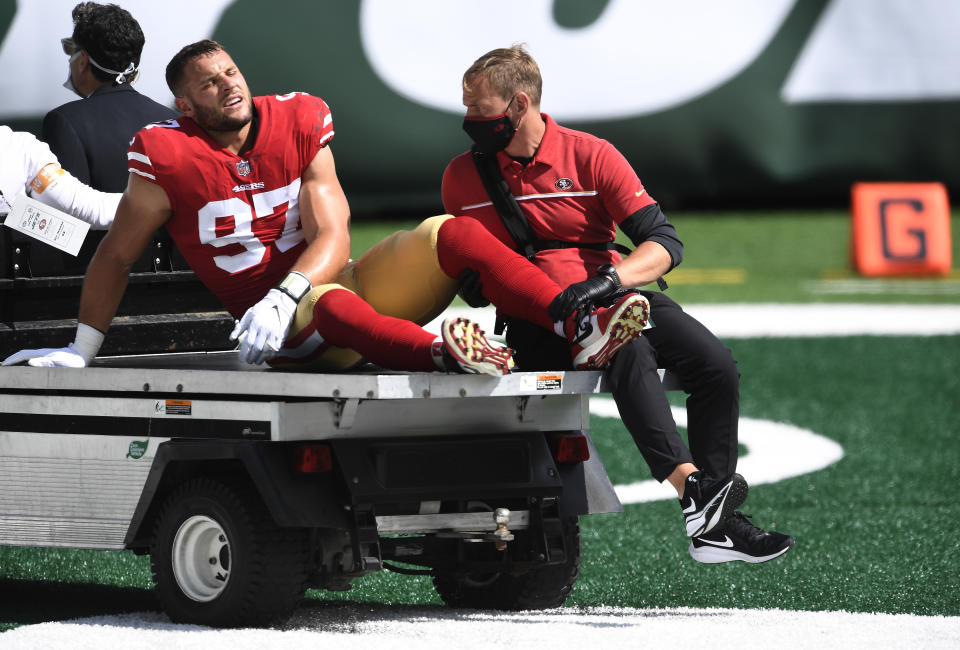 Nick Bosa is carted off the field after sustaining an injury against the Jets at MetLife Stadium.