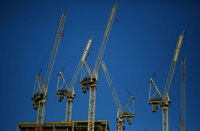 FILE PHOTO: Cranes fill the sky above a construction site in central London, August 21, 2018. REUTERS/Phil Noble