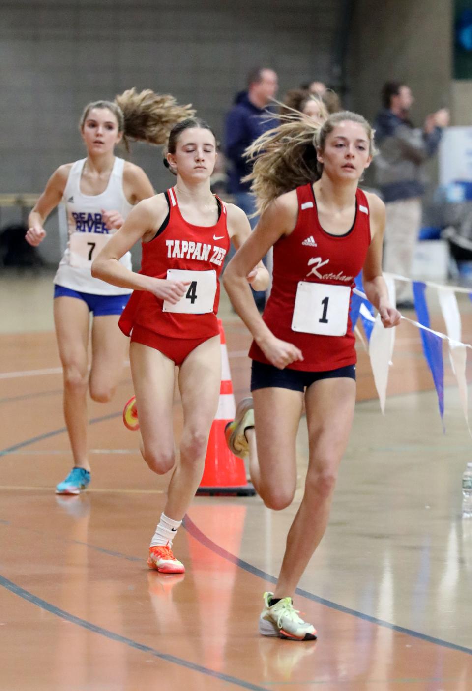 Abigail Kowalczyk (1) from Roy C. Ketcham High School leads Tappan Zee's Bridget Dunn during the girls 3,000-meter race at the Suffern Invitational Track and Field meet at Rockland Community College in Suffern, Jan. 13, 2023. Kowalczyk won with Dunn in  second.