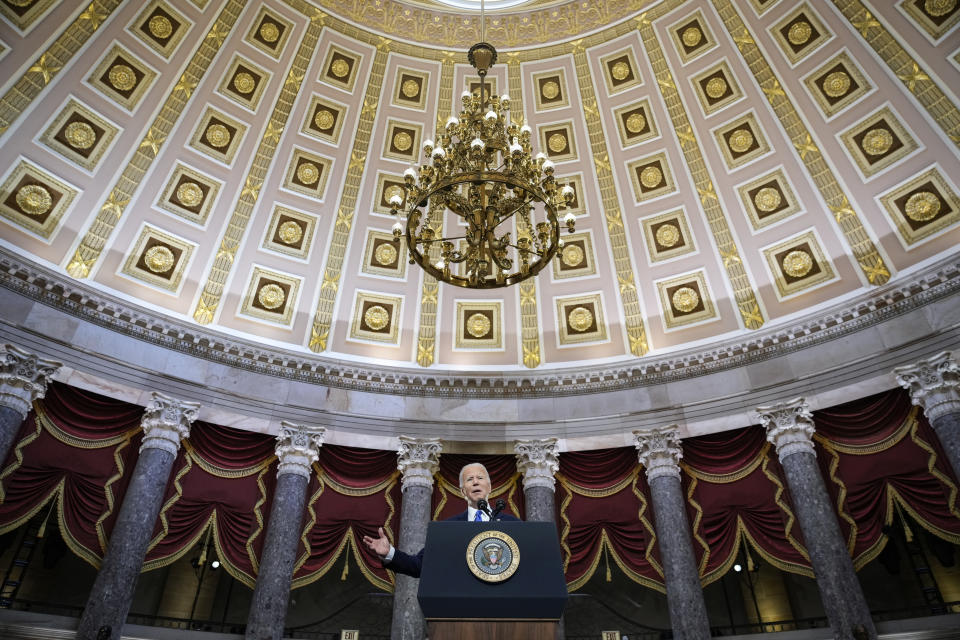 President Joe Biden delivers remarks on the one year anniversary of the January 6 attack on the U.S. Capitol, during a ceremony in Statuary Hall, Thursday, Jan. 6, 2022, at the Capitol in Washington. (Drew Angerer/Pool via AP)