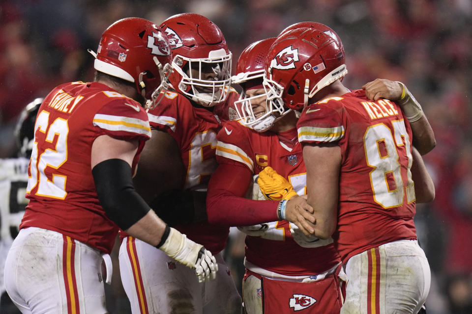 Kansas City Chiefs quarterback Patrick Mahomes (15) is helped by teammates after a play against the Jacksonville Jaguars during the second half of an NFL divisional round playoff football game, Saturday, Jan. 21, 2023, in Kansas City, Mo. (AP Photo/Jeff Roberson)