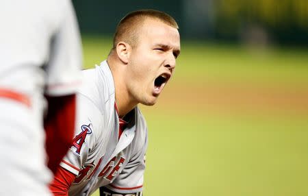 Oct 2, 2015; Arlington, TX, USA; Los Angeles Angels center fielder Mike Trout (27) reacts to hitting a triple in the ninth inning against the Texas Rangers at Globe Life Park in Arlington. Los Angeles won 2-1. Mandatory Credit: Tim Heitman-USA TODAY Sports