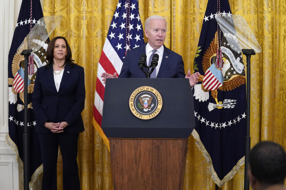 President Joe Biden speaks during an event to mark the passage of the Juneteenth National Independence Day Act, in the East Room of the White House, Thursday, June 17, 2021, in Washington. Vice President Kamala Harris stands at left. (AP Photo/Evan Vucci)