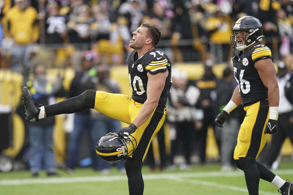 Pittsburgh Steelers' T.J. Watt (90) and Alex Highsmith (56) celebrate after the Steelers defeated the Baltimore Ravens in an NFL football game in Pittsburgh, Sunday, Oct. 8, 2023. (AP Photo/Matt Freed)