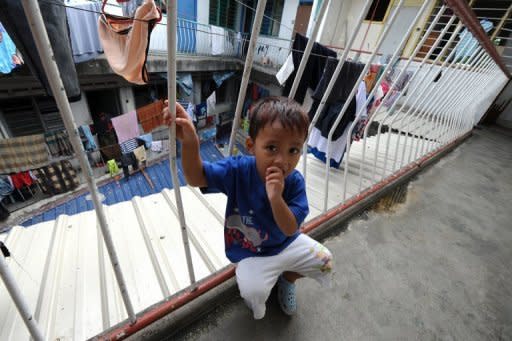 A former refugee from Myanmar now settled in Malaysia poses for a photograph at his home in Kuala Lumpur on August 31. Australia's government has renewed its call for a refugee swap deal with Malaysia after an asylum seeker boat sank off remote Christmas Island leaving up to around 90 people dead or unaccounted for