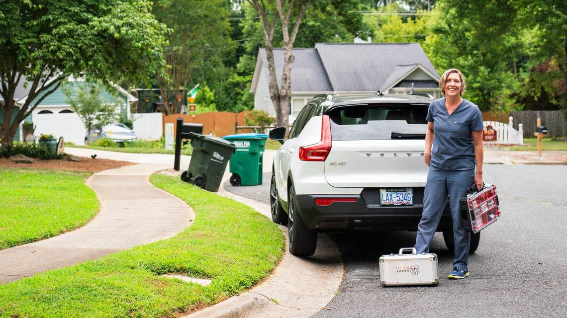 Dr. Meredith Binder leavesone of her client’s homes in Matthews N.C. Binder treats her car as her mobile office.