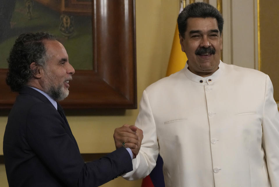 Venezuela´s President Nicolas Maduro, right, meets Colombia's new ambassador Armando Benedetti at Miraflores Palace in Caracas, Venezuela, Monday, Aug 29, 2022. Colombia has not had an ambassador in Venezuela since Feb. 2019. (AP Photo/Ariana Cubillos)