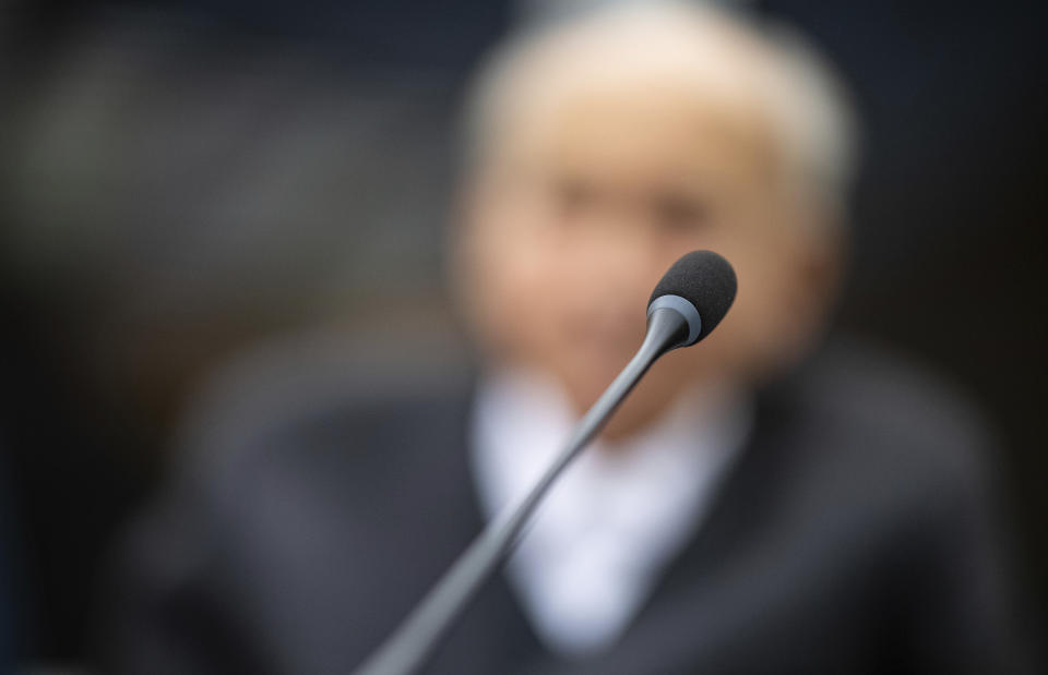 Johann Rehbogen, a 94-year-old former SS enlisted man, who is accused of hundreds of counts of accessory to murder for alleged crimes committed during the years he served as a guard at the Nazis’ Stutthof concentration camp, waits for the beginning of the third day of his trial at the regional court in Muenster, western Germany, Tuesday, Nov. 13, 2018. (Guido Kirchner/pool photo via AP)