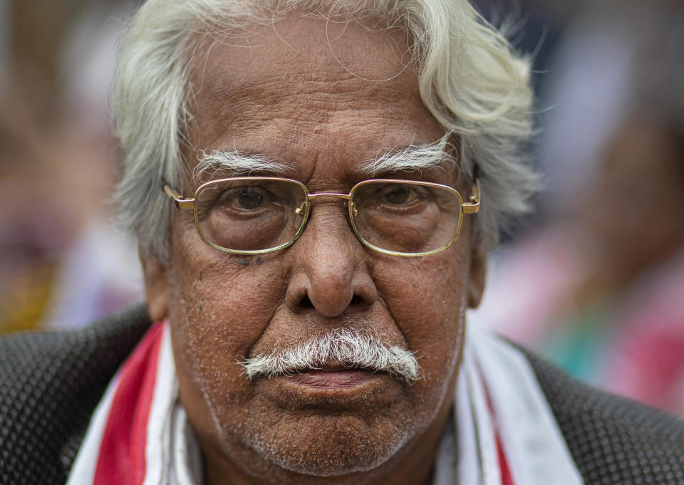 In this Monday, Dec. 23, 2019, photo, Nityananda Phukan, 77, participates in a protest against the Citizenship Amendment Act (CAA) in Gauhati, India. Tens of thousands of protesters have taken to India’s streets to call for the revocation of the law, which critics say is the latest effort by Narendra Modi’s government to marginalize the country’s 200 million Muslims. Phukan demanded that the government withdraw the act immediately. "I am ready to take bullet in my chest but will not allow the CAA to be implemented," he said. (AP Photo/Anupam Nath)