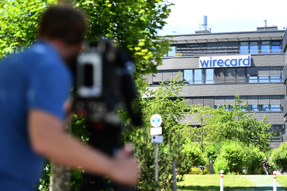 ASCHHEIM, GERMANY - JULY 01: Media gathers outside the corporate headquarters of payments processor Wirecard during a raid by investigators on July 1, 2020 in Aschheim, Germany. According to media reports state investigators are searching Wirecard offices as well as the residence in Vienna of Wirecard CEO Markus Braun. The company recently declared bankruptcy and its executives are being investigated for fraud. (Photo by Lennart Preiss/Getty Images)