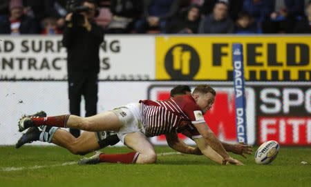 Britain Rugby League - Wigan Warriors v Cronulla-Sutherland Sharks - World Club Challenge - DW Stadium - 19/2/17 Joe Burgess scores the forth try for Wigan Warriors and completes his hat trick Mandatory Credit: Action Images / Ed Sykes Livepic