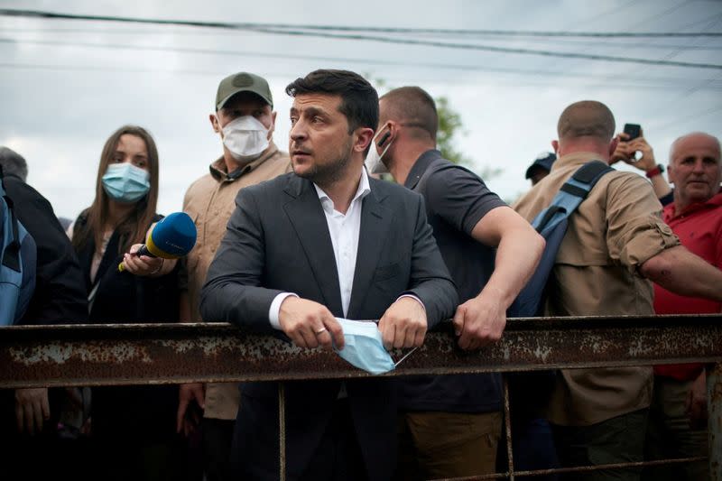 FILE PHOTO: Ukrainian President Zelenskiy visits a settlement affected by heavy rainfall and flooding in Ivano-Frankivsk Region