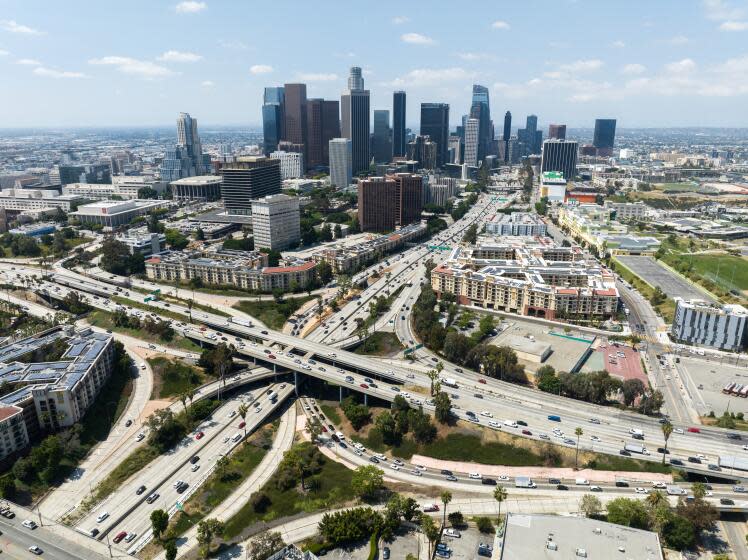 LOS ANGELES, CA - JUNE 23: Los Angeles skyline and the four-level interchange where the 110 and 101 freeways meet. Photographed in Los Angeles, CA on Friday, June 23, 2023. (Myung J. Chun / Los Angeles Times)