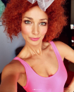 <p>The Aussie beauty wore hot-pink make-up and a curly red wig.</p>