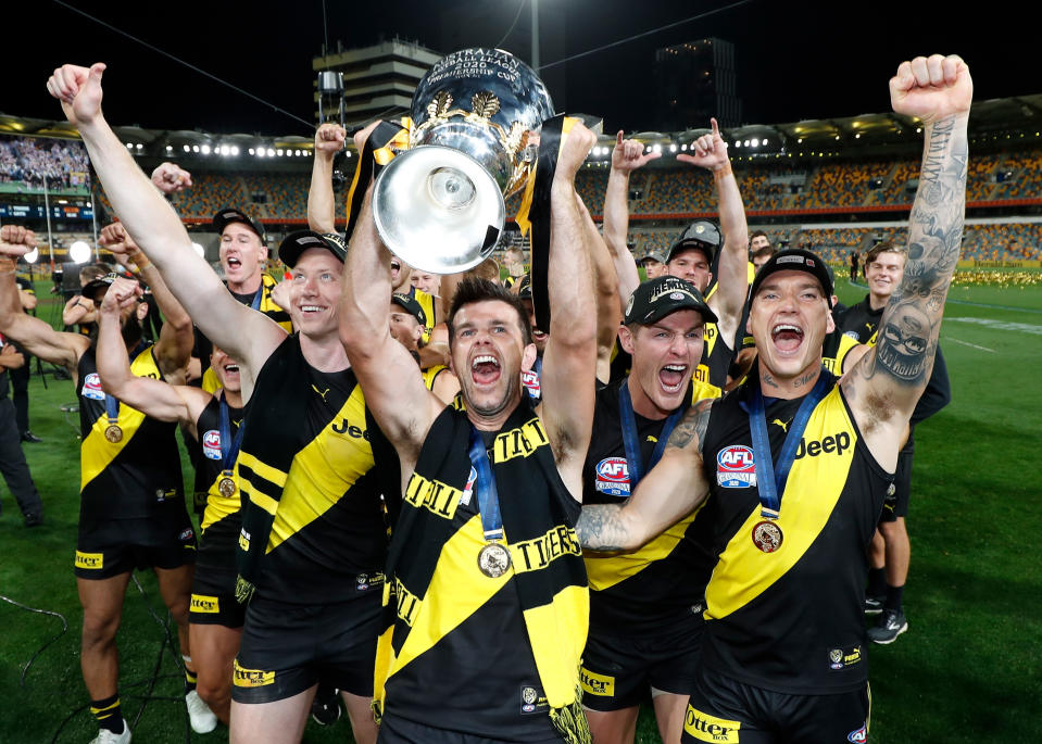 BRISBANE, AUSTRALIA - OCTOBER 24: Trent Cotchin (left) and Dustin Martin of the Tigers celebrate during the 2020 Toyota AFL Grand Final match between the Richmond Tigers and the Geelong Cats at The Gabba on October 24, 2020 in Brisbane, Australia. (Photo by Michael Willson/AFL Photos via Getty Images)