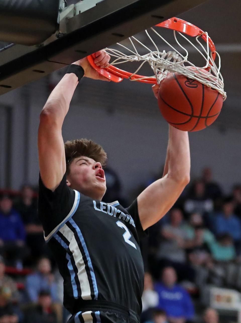 Louisville forward Brayden Gross dunks during the first half of a basketball game in the Canton Play-By-Play Classic at Canton Memorial Field House, Saturday, Feb. 17, 2024, in Canton, Ohio.