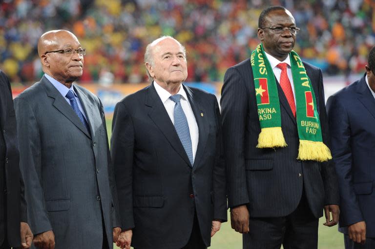 (From L) South African President Jacob Zuma, FIFA president Sepp Blatter and Burkina Faso's Prime Minister Luc Adolphe Tiao listen to the national anthems before the kick off of the 2013 African Cup of Nations final