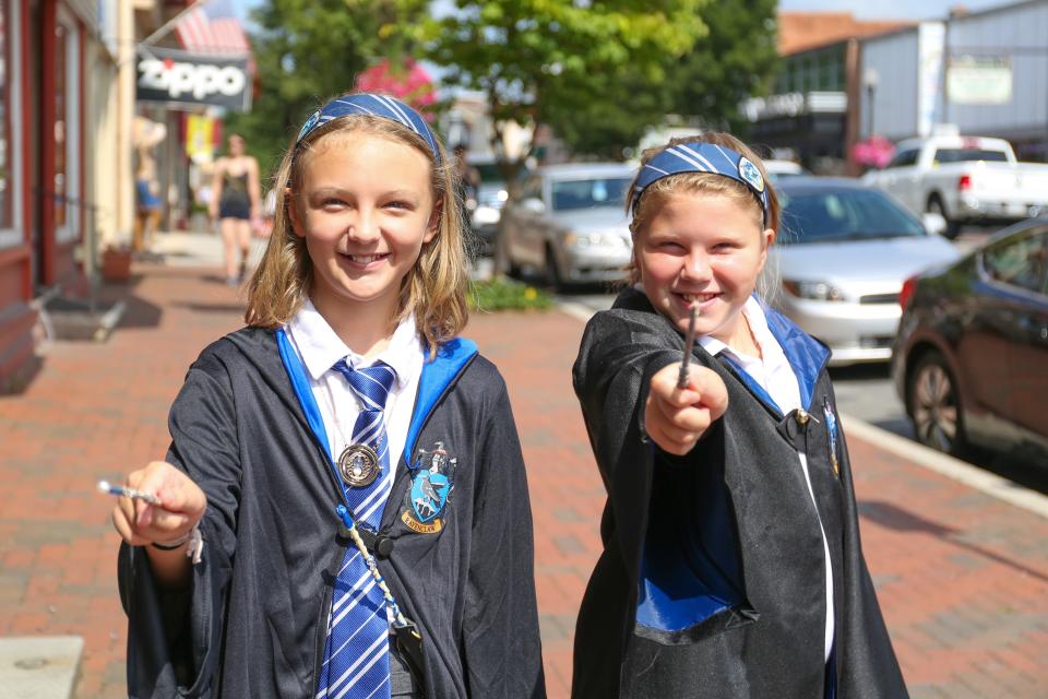 Two girls "cast spells" at the 2020 Wizarding Weekend in Waynesboro.