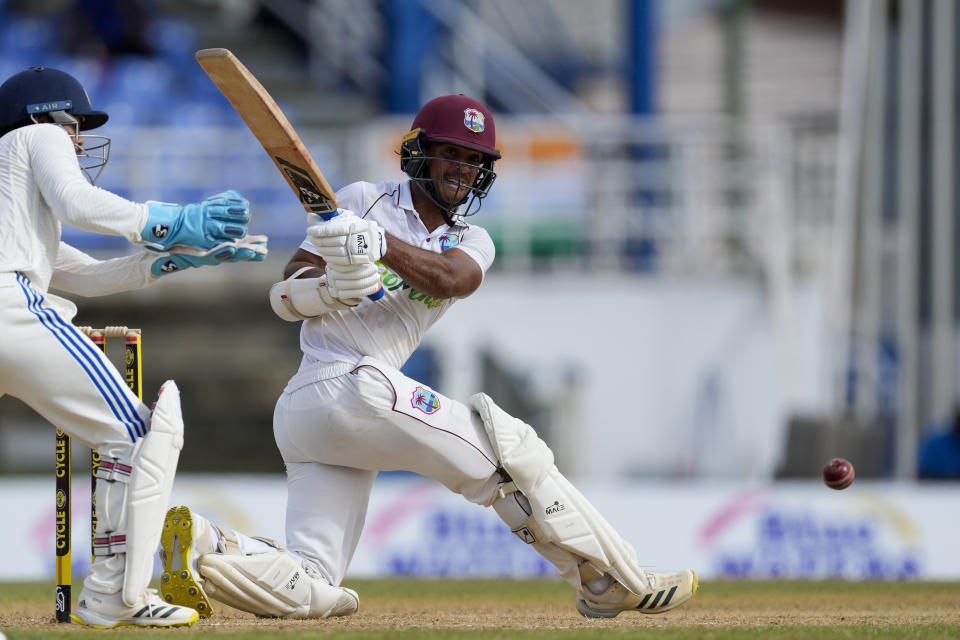 West Indies' Tagenarine Chanderpaul plays a shot from the bowling of India's Ravichandran Ashwin on day two of their second cricket Test match at Queen's Park in Port of Spain, Trinidad and Tobago, Friday, July 21, 2023. (AP Photo/Ricardo Mazalan)