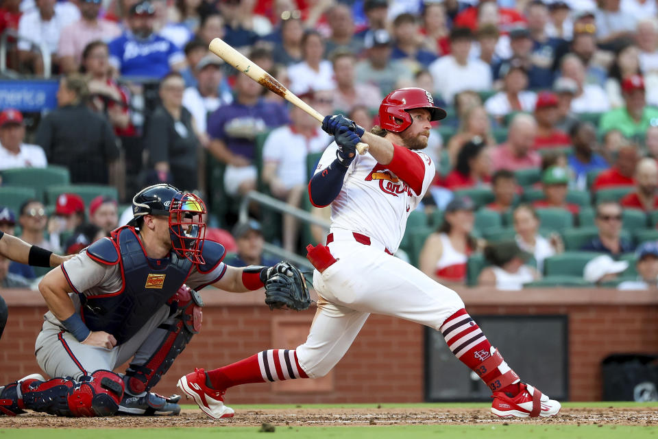 St. Louis Cardinals' Brendan Donovan, right, hits an RBI single during the third inning of a baseball game against the Atlanta Braves, Monday, June 24, 2024, in St. Louis. (AP Photo/Scott Kane)