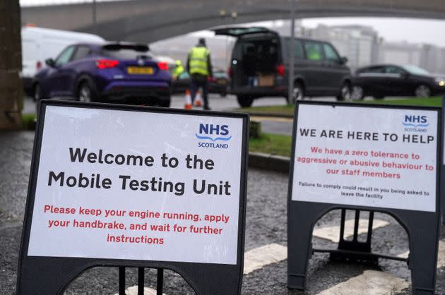 &lt;strong&gt;Signs at a mobile Covid-19 test site in Glasgow, Scotland, where people have been asked to reduce their social contact as much as possible by meeting in groups of no more than three households.&lt;/strong&gt; (Photo: Andrew Milligan via PA Wire/PA Images)