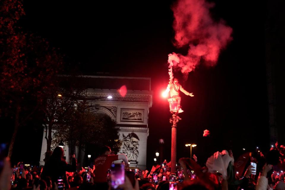 File: Paris-based Morocco fans earlier took to the Champs-Elysees to celebrate after their quarter-final win over Portugal (AP)