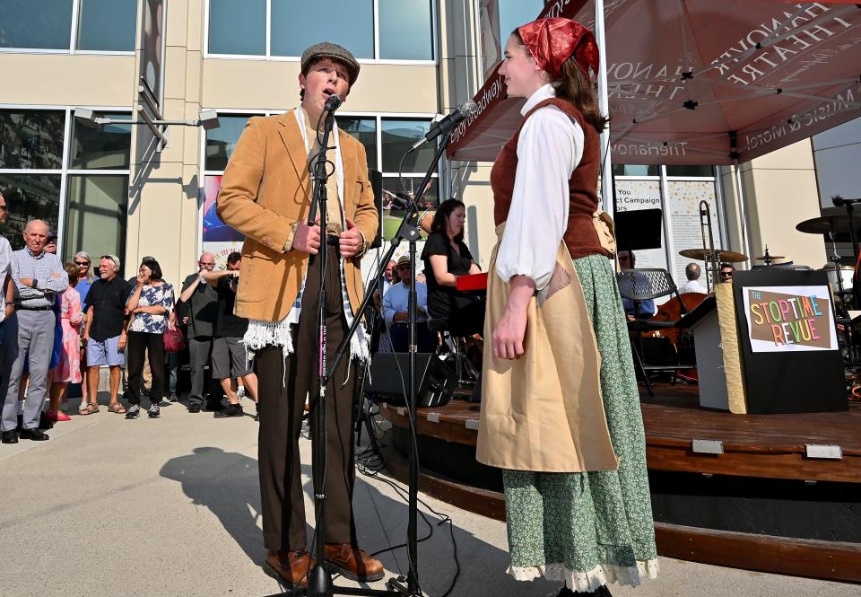 Andrew Byron and Tori Rich, students of The Hanover Theatre Conservatory’s Youth Summer Program, perform a duet from "Fiddler on the Roof" during the rededication of the Francis R. Carroll Plaza Wednesday evening.