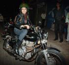 Gul Panag rides her Royal Enfield motorcycle. On her wedding day, the adventurous diva and her groom Rishi Attari arrived on a bike at the reception venue.