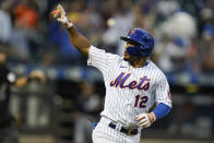 New York Mets' Francisco Lindor (12) gestures to fans as he runs the bases after hitting a two-run home run during the sixth inning in the first baseball game of a doubleheader against the Miami Marlins Tuesday, Sept. 28, 2021, in New York. The Mets won 5-2. (AP Photo/Frank Franklin II)