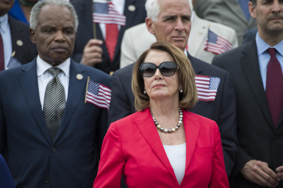 <p>House Minority Leader Nancy Pelosi, D-Calif., and House Democrats hold a rally on the steps of the Capitol to call for passage of “The Keep Families Together Act,” that would stop the separation of parents and children at the border of the U.S. and Mexico on June 20, 2018. (Photo: Tom Williams/CQ Roll Call/Getty Images) </p>