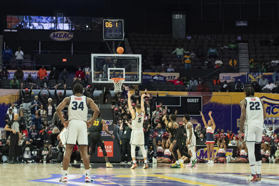 Howard guard Jelani Williams (5) shoots a free-throw and the winning basket in the closing seconds of second half of an NCAA college basketball game against Norfolk State in the championship of the Mid-Eastern Athletic Conference Tournament, Saturday, March 11, 2023, in Norfolk, Va. (AP Photo/Mike Caudill)