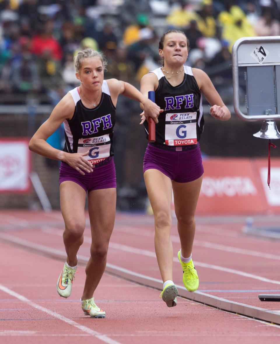 Rumson-Fair Haven Clemmie Lilley takes the handoff from teammate Julia Shanes during the High School Girls' 4X800 Championship of America Race. Day Three of Penn Relays in Philadelphia, Pa. On April  29, 2023. 