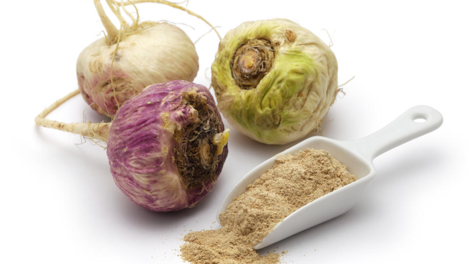 Maca roots next to maca powder, which benefits females