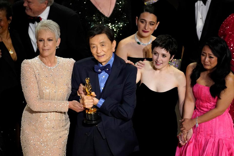 From left, Jamie Lee Curtis, James Hong, Milton native Jenny Slate, Tallie Medel and Stephanie Hsu accept the award for best picture at the Oscars on Sunday, March 12, 2023, at the Dolby Theatre in Los Angeles.